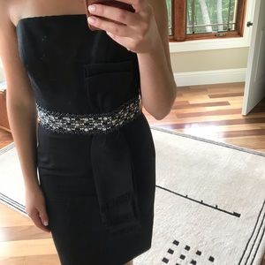 Black strapless dress with a beaded belt
